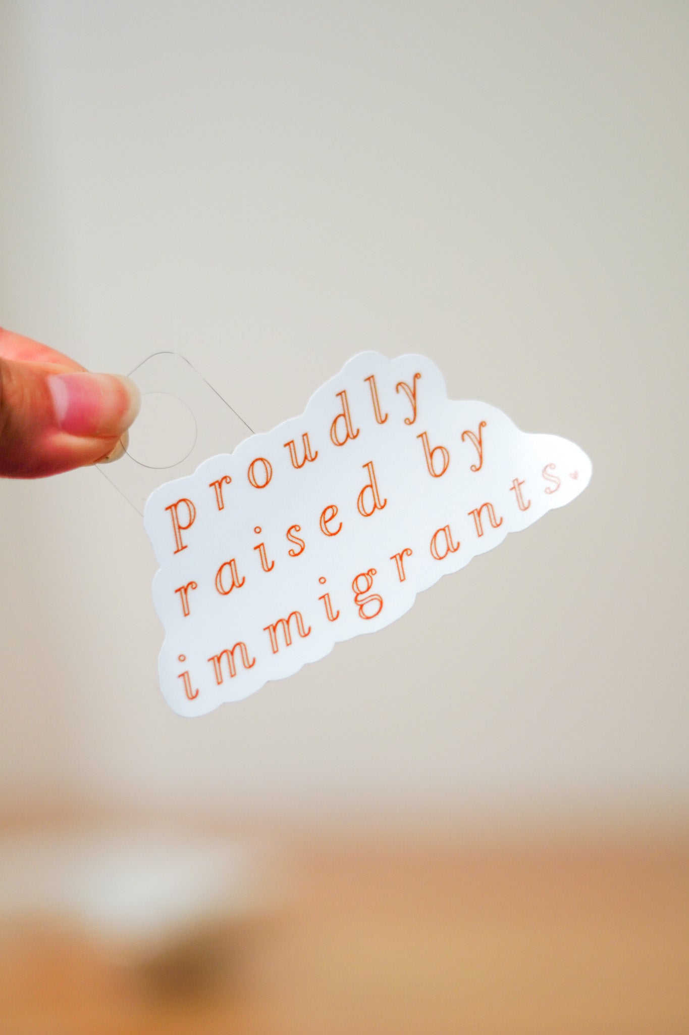 'Proudly Raised By Immigrants' Sticker